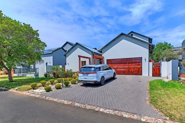 An elegant entrance takes you into a neat home, perfect for a small family. The house features a combination of natural elements and ...