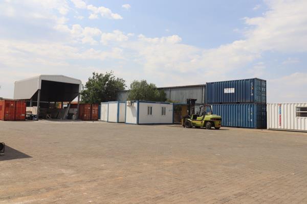 Outstanding commercial property with a perfect blend of modern offices, a large warehouse, storage at the back, and ample parking space ...