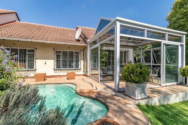 Lounge leading to sunny all-year conservatory with sliding doors onto the garden and plunge pool.

Lovely large garden with wonderful ...