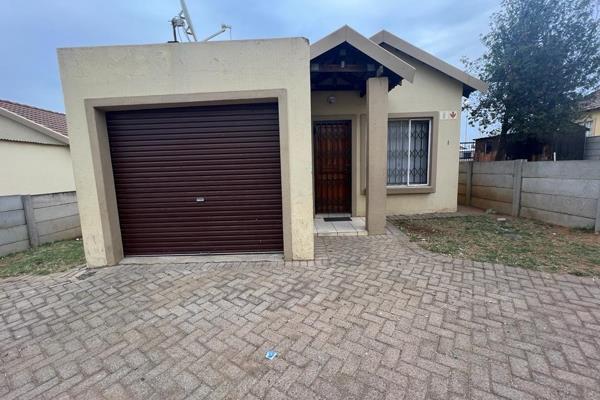 You&#39;ll feel a warm welcome as you enter this charming house, where a neatly tiled open-plan living room seamlessly merges with a ...