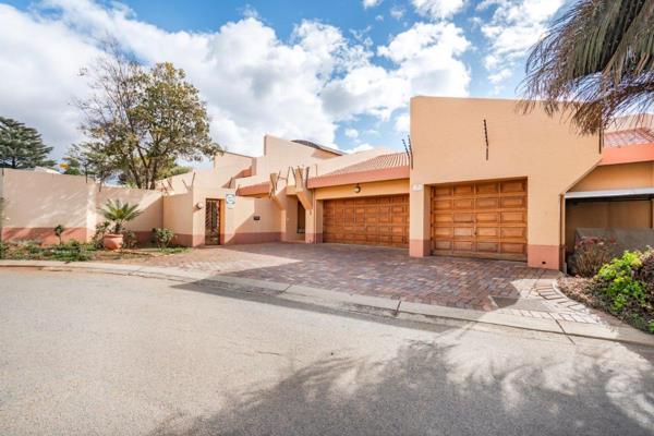 Presenting a generous family home within a security-controlled boomed street and small ...