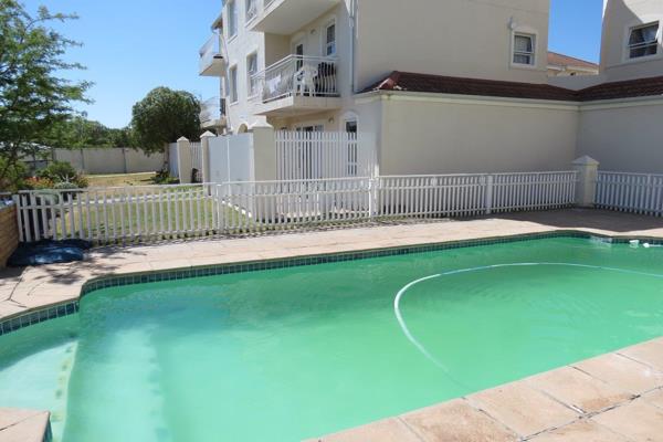 Immaculate flat with doors opening onto private patio and carport 5 meters from the ...