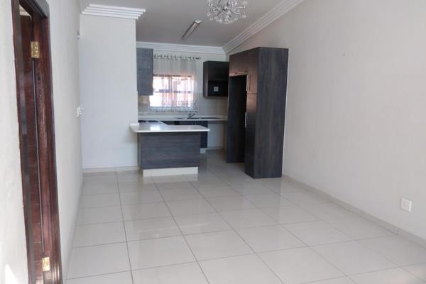 Modern 3 bedroom fully tiled unit with two bathrooms, of which the main bedroom has a en suite with shower, basin and toilet. 
The ...