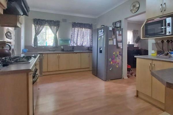 Three-bedroom family home with two bathrooms, open plan lounge and dining room, and a neatly fitted kitchen with scullery / laundry ...