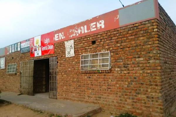 A spacious building that has been operated as a supermarket to date, offers a small living space that consists of a bedroom, bathroom ...