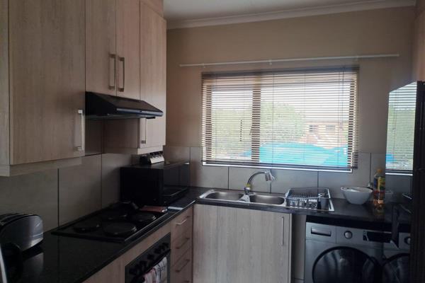 2 bedrooms all fitted with built-in cupboards and tiled flooring.

2 bathrooms;
1st bathroom has a bath, toilet and basin.
2nd ...