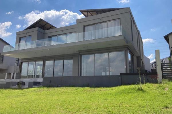 A 5 bedroom house.
Entering this home, you are welcomed by an awesome view to lake through those sliding doors, and glass entrance ...