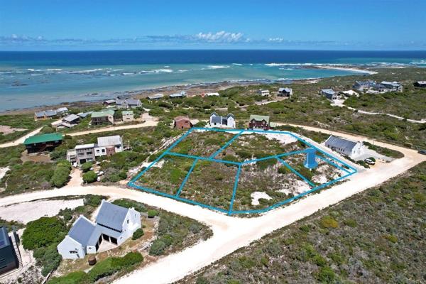 Joint Mandate: Discover a 700m2 vacant plot ideally situated in close proximity to Suiderstrand&#39;s renowned &quot;Pebble ...