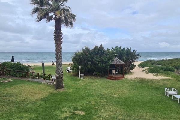 Just a few steps from your patio to the beach.  This is the ideal holiday apartment.  Visit with family and friends having a braai and ...