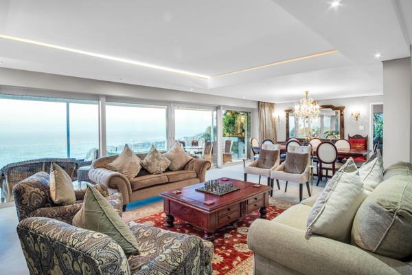 Perched high up in Camps Bay, this 4 bedroom en-suite Villa is available for daily rental.  Situated on a large stand, this 3 story ...