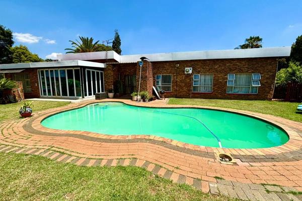 This stunning four bedroom home, nestled in the inviting community of Sunward Park ...