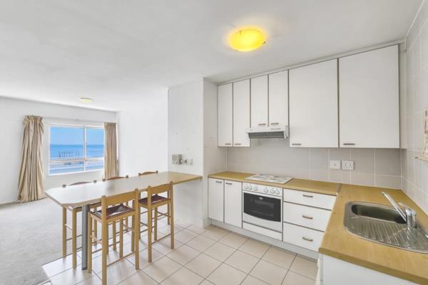 Introducing a charming two-bedroom apartment in Three Anchor Bay with partial sea views from the open plan lounge, dining, and kitchen ...