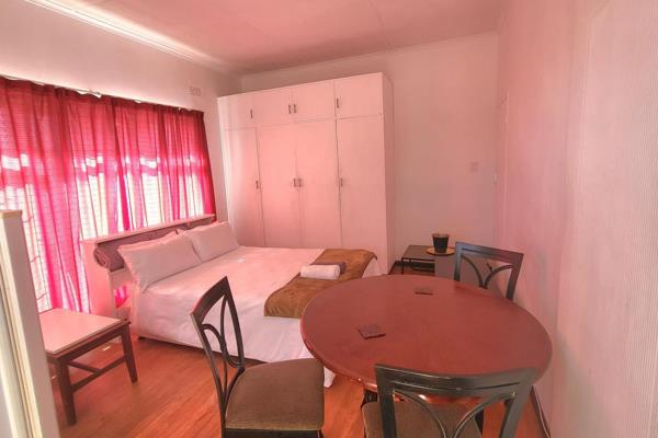 This huge bedroom is furnished and open plan with built-in-cupboards, kitchenette, small dining room table, shower and toilet. Also ...