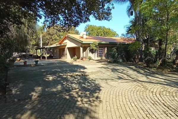 Offers welcome.
This large family home for sale is situated on a one hectare plot in The Willows in Pretoria East.
The living areas are ...