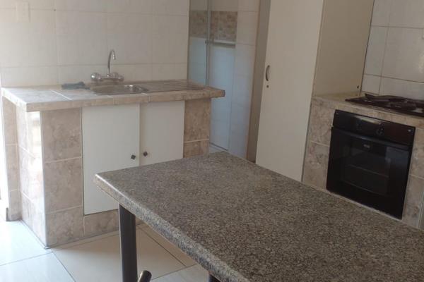 Neat bachelor cottage with open plan kitchen fitted with stove, the unit is fully tiled, bathroom has a shower, the rent includes ...