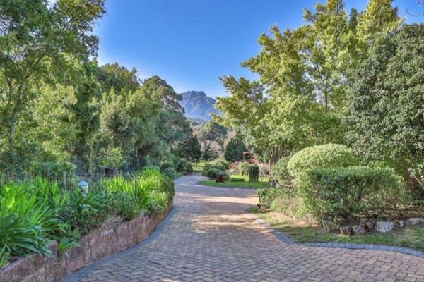 Relish in the beauty and comfort of the Hout Bay valley in this spacious home situated ...