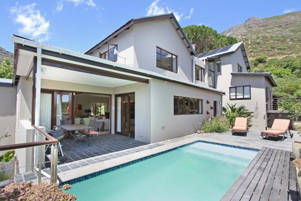 Situated on the upper, north facing slopes of Hout Bay, this beautiful and spacious home is secure and offers five bedrooms with four ...