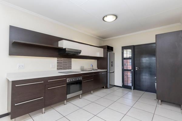 Upon entrance, one is welcomed into an immaculate and modern apartment.

The open plan ...