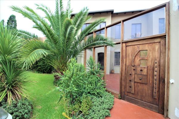 This unique property is divided into two separate units. The top story is rented out separately, and the bottom house, which is ...