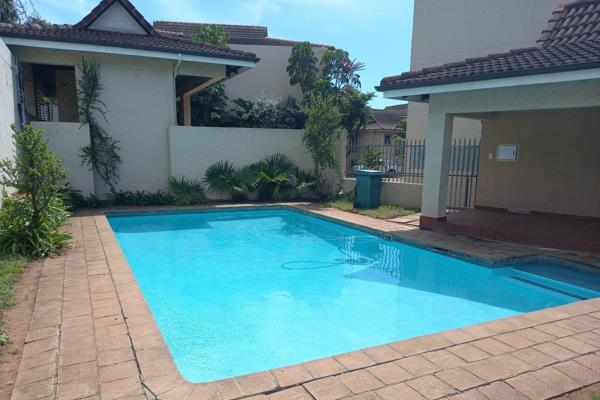 Located in a secure complex that boasts a swimming pool and is close to the beach, this ...