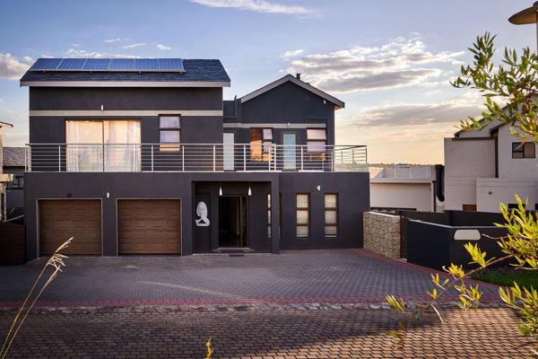 Dramatic shades of grey dominate in this contemporary home, coupled with glossy tiles ...