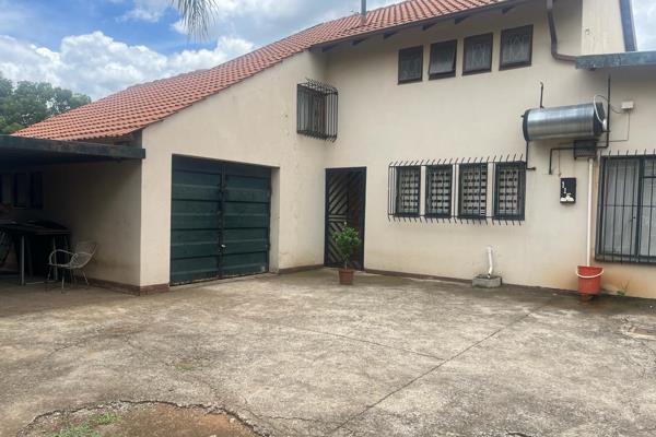 This double Storey house has 2 entrances to the property. 

Two living areas; a lounge and a dining room. The kitchen has ample ...