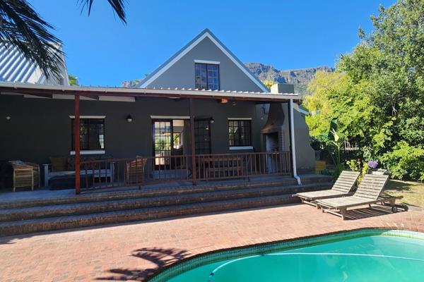 Light and bright newly renovated 2 bedroomed/2 bathroom cottage located in a quiet cul-de-sac in Hout Bay - with lovely mountain views. ...