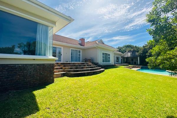 This chic home offers an entrance hall with a character; a private dining lounge; a sliding door leading to a spacious lounge; a fire ...