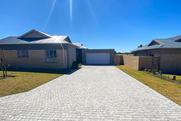 Nestled in the picturesque Mooikloof area of George, Western Cape, this charming single-story home epitomizes modern comfort and ...