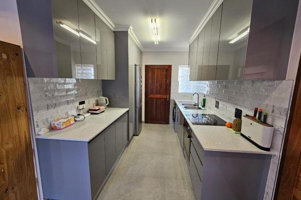 Step through the front door and be welcomed by the inviting kitchen to your right ...