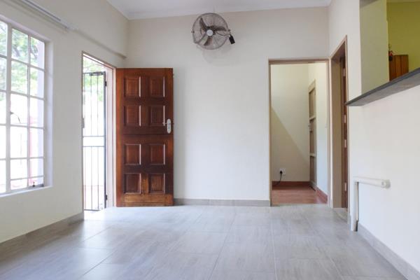 This is a newly renovated flat with modern tiling, a carpeted bedroom and a large double ...