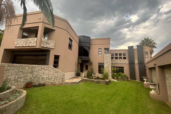 Welcome to a prestigious oasis nestled in one of the most sought-after areas of Rustenburg. This opulent 5-bedroom property exudes ...