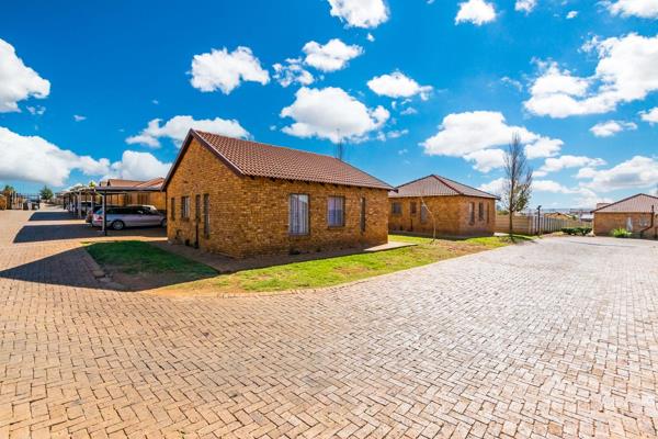 Charming three-bedroom house nestled in the desirable Protea Glen Estate, where comfort ...