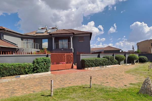 The House is perfectly situated at a corner stand with access to the main road, it has 4 bedrooms , three of the bedrooms have ensuite ...