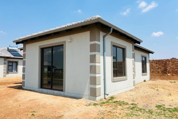 This charming two-bedroom house features a single bathroom and an open-plan kitchen ...