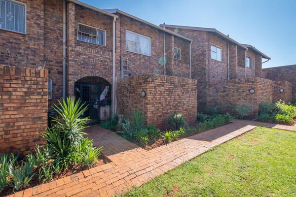 A 3 bedroom townhouse with 1 bathroom, guest toilet, lounge, dining room, kitchen, courtyard, 1 lockup garage, own private garden, and ...