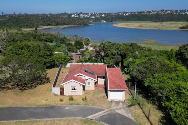 Welcome to your new home nestled in a serene and secure estate on the tranquil banks of the Quinera Lagoon. This charming 3-bedroom ...