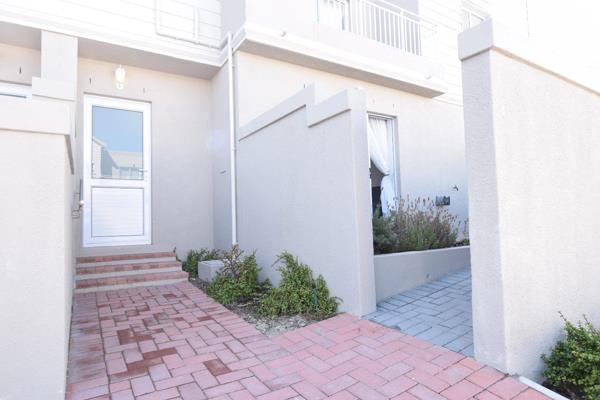 Step into this radiant home, where a thoughtfully crafted kitchen greets you with plentiful cupboard space. The seamless flow of the ...