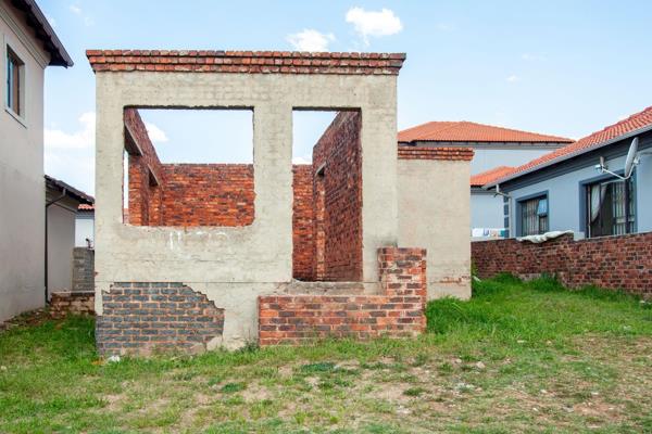 Welcome to this remarkable unfinished house, halfway to roofing, where endless possibilities await. With its excellent location and ...