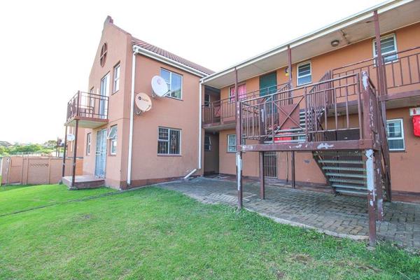 Quaint 2 bedroomed apartment is tiled throughout with one bathroom and ...