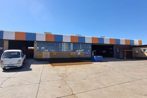 This property features a substantial office component connected to multiple warehouse ...