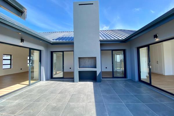 Tucked away in the prestigious Bowtie Private Estate in Plettenberg Bay, this stunning three-bedroom home is a sanctuary for families ...