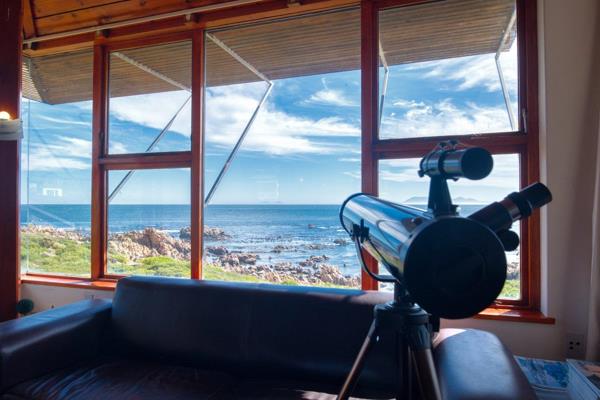 A double storey home built with views across False Bay to Cape Point lighthouse, Simons ...