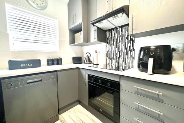 Lock up and go you said? This unique 2 bedroom with double garage home  is fully tiled ...