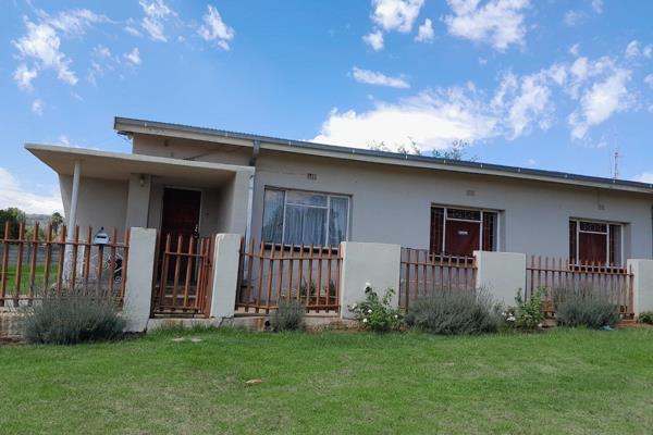 This three-bedroom family home on a large 1190m&#178; stand in Lower Rensburg has an open plan lounge and dining room, spacious ...