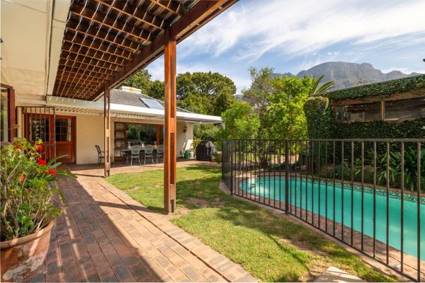 In the Heart of Hiddingh

Family home with breathtaking mountain views.  North-facing with a pool set in a private garden.

This home ...