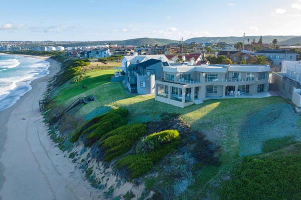 View by Appointment: Nestled in the idyllic coastal town of Hartenbos, this front row property in Bayview offers an unmatched ...