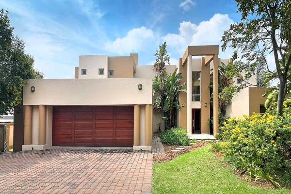 This architectural masterpiece is built for family living.  Enter through a pivot front door into a large entrance hall with an atrium ...