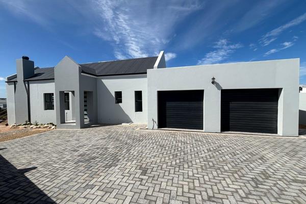 Nestled in Langebaan, Western Cape, this inviting single-story home offers the perfect blend of comfort and convenience. Boasting three ...