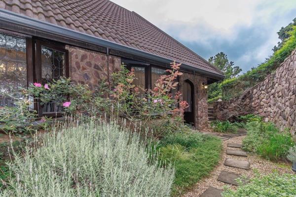 Nestled within the prestigious, 24-hour guarded Camelot Golf Estate, this enchanting Tudor-style cottage offers a serene and secure ...